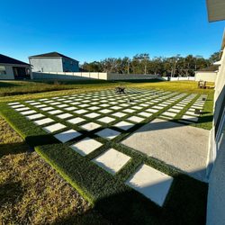 Gold Brick Pavers - Back patio artificial grass/ concrete design
Call In for a project like this.