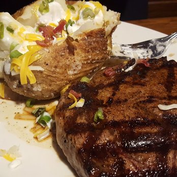 Outback Steakhouse - Loaded baked potato, Ribeye, medium rare (A-) Potato could have more sour cream, really skimpy. But steak was A++! - Steakhouses Near Me - Osage Beach, Missouri Outback Steakhouse - Loaded baked potato, Ribeye, medium rare (A-) Potato could have more sour cream, really skimpy. But steak was A++! - Steakhouses Near Me - Osage Beach, Missouri