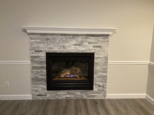 Flooring and custom fireplace - This remodel included the removal of old flooring and fireplace mantle to update the look of the home. This job took three days and consisted of the installation of 400 sq ft of flooring, 4 1/4” base molding and a new custom fireplace mantle Flooring and custom fireplace - This remodel included the removal of old flooring and fireplace mantle to update the look of the home. This job took three days and consisted of the installation of 400 sq ft of flooring, 4 1/4” base molding and a new custom fireplace mantle