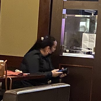 Hayashi Hibachi - Women using her smartphone with working gloves on - Japanese Near Me - McAllen, Texas Hayashi Hibachi - Women using her smartphone with working gloves on - Japanese Near Me - McAllen, Texas