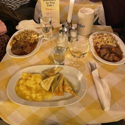 Goulash with spaetzle; vegetarian dumplings with potato salad.