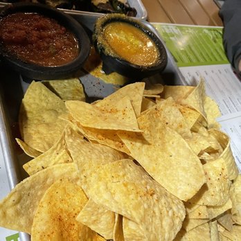 Social Cantina - Chips & salsa we chose the mango habanero to try. Sweet and very spicy. Jalapeño Relleno on the other side - Tacos Near Me - Bloomington, Indiana
