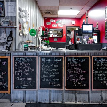 Horn Dawgs - a restaurant counter with menus - Chicken Wings Near Me - Pickering, Ontario
