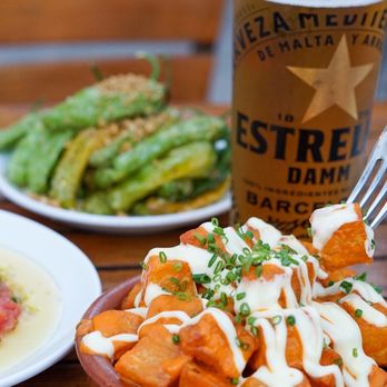 Barceloneta - a plate of food and a glass of beer - Spanish Near Me - Miami Beach, Florida