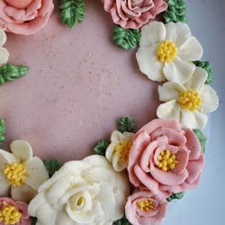 Bespoke cake with buttercream floral wreath.