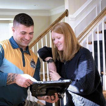 Thomas Edison Electric - Electrician reviewing electrical work details with a homeowner in Stuart, FL. - Electricians Near Me - Jupiter, Florida Thomas Edison Electric - Electrician reviewing electrical work details with a homeowner in Stuart, FL. - Electricians Near Me - Jupiter, Florida