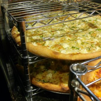 Rocco's - Jalapeno face. Pizzas displayed on racks at entrance. - Bars Near Me - Seattle, Washington Rocco's - Jalapeno face. Pizzas displayed on racks at entrance. - Bars Near Me - Seattle, Washington