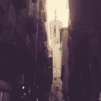 Barri Gòtic - One of many narrow corridors leading into large, beautiful courtyards. - Local Flavor Near Me Barri Gòtic - One of many narrow corridors leading into large, beautiful courtyards. - Local Flavor Near Me