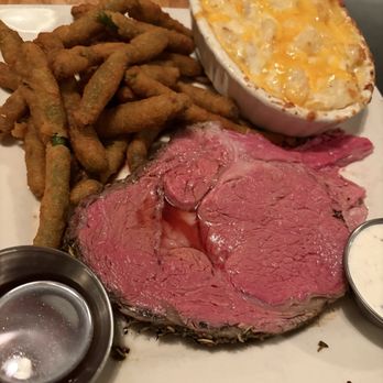 Hungry Hunter Steakhouse - Medium-rare prime rib with potatoes au-gratin - Steakhouses Near Me - Bakersfield, California Hungry Hunter Steakhouse - Medium-rare prime rib with potatoes au-gratin - Steakhouses Near Me - Bakersfield, California