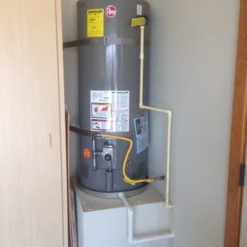 Emerald Plumbing - a water heater in a garage - Plumbing Near Me - Pismo Beach, California Emerald Plumbing - a water heater in a garage - Plumbing Near Me - Pismo Beach, California