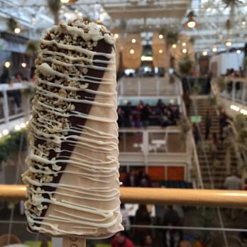 Popbar - Hazelnut gelatoPop with a dark chocolate half dip, pistachios, almonds and a white chocolate drizzle - Desserts Near Me - Anaheim, California Popbar - Hazelnut gelatoPop with a dark chocolate half dip, pistachios, almonds and a white chocolate drizzle - Desserts Near Me - Anaheim, California