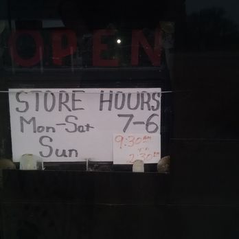 T-Mart - a sign in the window of a store - Convenience Stores Near Me - Sunrise Beach, Texas