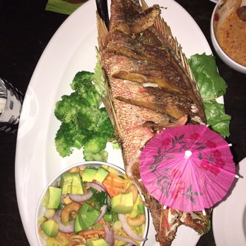 Am Thai Bistro - Snapper and mango salad w/ fried rice. Cute umbrella. - Thai Near Me - Brooklyn, New York