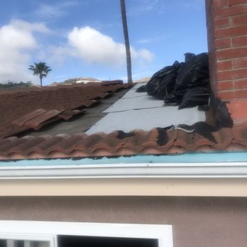 Bay Harbor Roofing - Exposed roof with trash bags left up there - Roofing Near Me - San Pedro, California