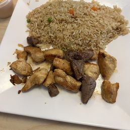 Chicken and steak combination with fried rice. Chicken and steak combination with fried rice.