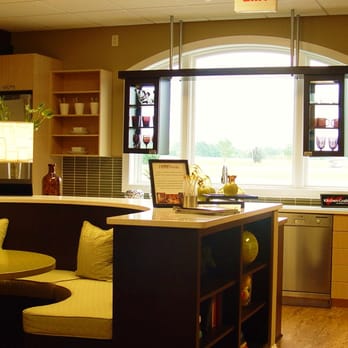 Marling Lumber and HomeWorks - This kitchen, done in Kitchencraft cabinetry featuring a natural finish, has a retro look and cabinets with a view. - Building Supplies Near Me - Janesville, Wisconsin Marling Lumber and HomeWorks - This kitchen, done in Kitchencraft cabinetry featuring a natural finish, has a retro look and cabinets with a view. - Building Supplies Near Me - Janesville, Wisconsin