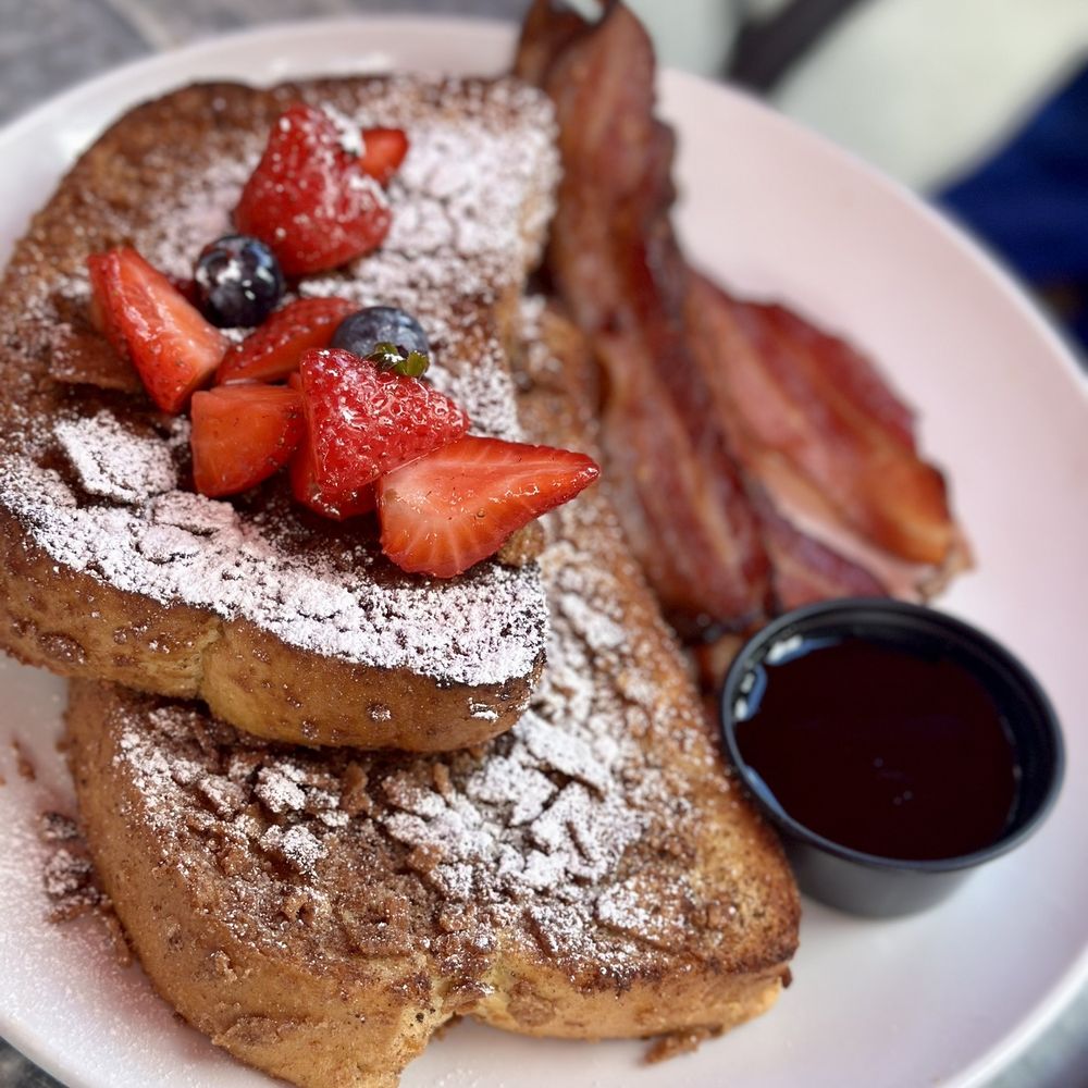 The Stubborn Mule - "The Frenchman" Cinnamon toast crusted french toast, topped with fresh berries & dusted with powdered sugar, served with maple pepper bacon - New American Near Me - Orlando, Florida The Stubborn Mule - "The Frenchman" Cinnamon toast crusted french toast, topped with fresh berries & dusted with powdered sugar, served with maple pepper bacon - New American Near Me - Orlando, Florida