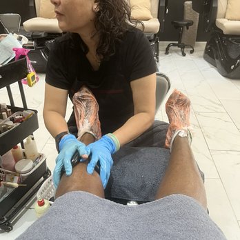 Cloud 9 Nail Bar - Hannah performing hot stone  massage and while the parrafin wax softens my feet - Nail Salons Near Me - Houston, Texas