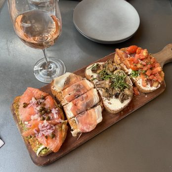 Postino LoHi - BRUSCHETTA ( CHOOSE 4 ) Left to right: smoked salmon pesto, PROSCIUTTO DI PARMA, mushroom, bacon tomato buratta - New American Near Me - Denver, Colorado Postino LoHi - BRUSCHETTA ( CHOOSE 4 ) Left to right: smoked salmon pesto, PROSCIUTTO DI PARMA, mushroom, bacon tomato buratta - New American Near Me - Denver, Colorado