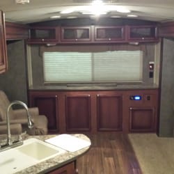 AAA RV Sales and Rental - Large 31ft travel trailer, has TV, 2 recliners, a couch, a dinette, full kitchen, full bathroom, and nice master bedroom.