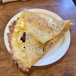We ordered the egg crepe with bacon and cheese it was so delicious we left happy plates! We ordered the egg crepe with bacon and cheese it was so delicious we left happy plates!