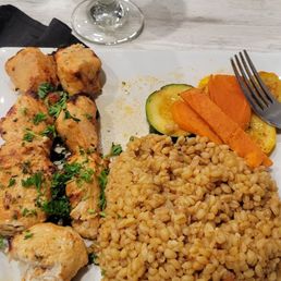Chicken Tikka? Very tender and well marinated. Racked wheat and veggies sides. Chicken Tikka? Very tender and well marinated. Racked wheat and veggies sides.