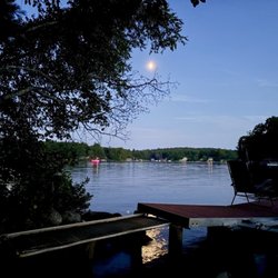 North of the Border - The moon, and boats heading home.