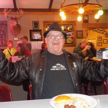 Buck Snort Bar & Grill - a man with his arms in the air - Bars Near Me - Colfax, Wisconsin Buck Snort Bar & Grill - a man with his arms in the air - Bars Near Me - Colfax, Wisconsin