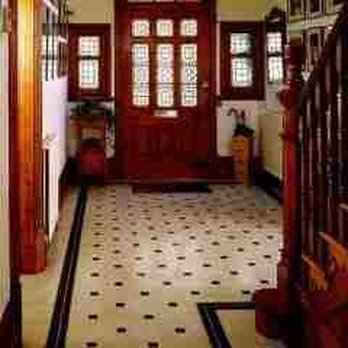 Sr Company - a hallway with a red door and a black and white floor - General Contractors Near Me - Redmond, Washington Sr Company - a hallway with a red door and a black and white floor - General Contractors Near Me - Redmond, Washington
