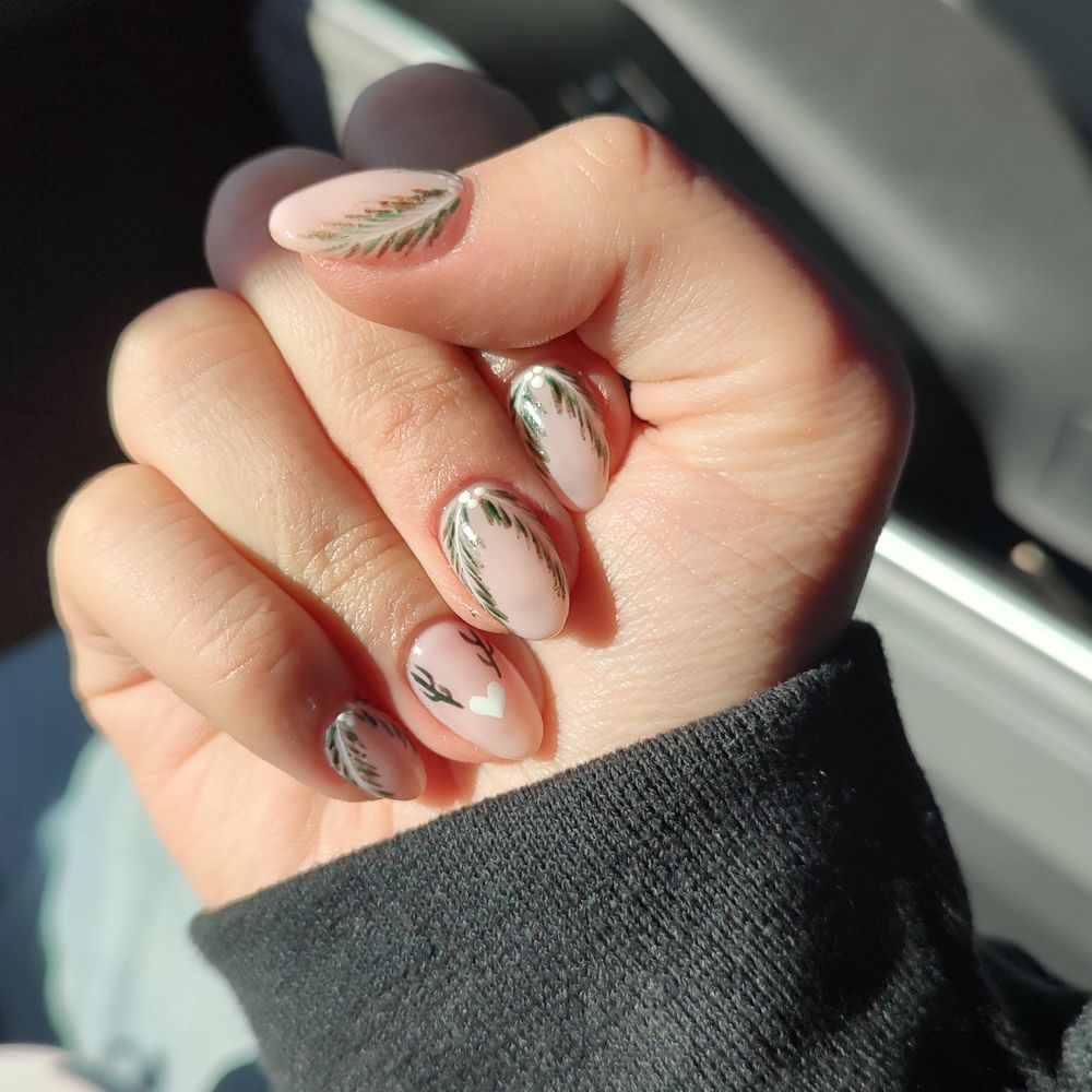 Vivi Nails Spa - Nude nails with holly branches, the ring finger has a white heart and a pair of antlers - Nail Salons Near Me - Las Vegas, Nevada Vivi Nails Spa - Nude nails with holly branches, the ring finger has a white heart and a pair of antlers - Nail Salons Near Me - Las Vegas, Nevada