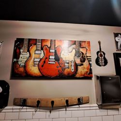 Fire Rock Burgers & Brews - Bathroom guitar art
