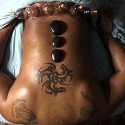 Lavish Effects Spa & Beauty Bar - Cupping to reduce pain and pressure in this clients low back and basalt stones to relax tense tired muscles.
