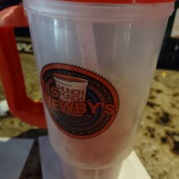 a drink in a plastic cup a drink in a plastic cup