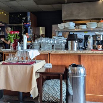 Aroma Cafe - The intimate dining space adjacent to his small galley kitchen - American Near Me - Rocky River, Ohio