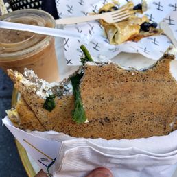 Son's blueberry and honey crepe; my bites on the omelette buckwheat creped and iced latte with oat milk. Son's blueberry and honey crepe; my bites on the omelette buckwheat creped and iced latte with oat milk.