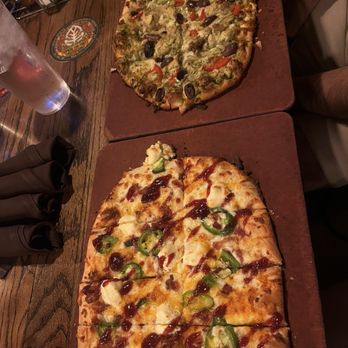 Independent Ale House - Bob's Popper Pizza (bottom- THE BEST!! Highly recommend!!) and Italian Pesto Pie (top) - Bars Near Me - Rapid City, South Dakota Independent Ale House - Bob's Popper Pizza (bottom- THE BEST!! Highly recommend!!) and Italian Pesto Pie (top) - Bars Near Me - Rapid City, South Dakota