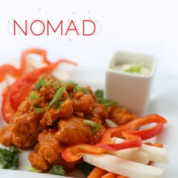 Nomad Kitchen and Lounge - FREE RANGE WASHINGTON CAYENNE "WINGS" Cut in house, local boneless thighs in local buttermilk batter and glazed with cayenne.