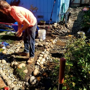Simple Wonders Landscape and Design - Making a custom dry riverbed with stepping stones! - Landscaping Near Me Simple Wonders Landscape and Design - Making a custom dry riverbed with stepping stones! - Landscaping Near Me
