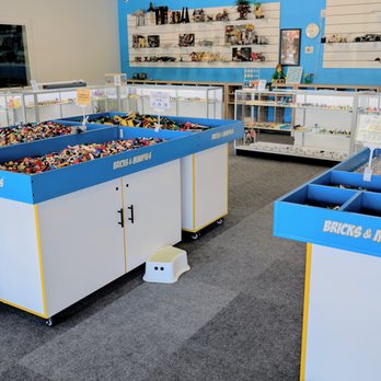 Bricks & Minifigs - The store entrance is right in front of the bulk tables. Grab a container to fill with any LEGO that will fit. Also build or pick a minifig! - Toy Stores Near Me - Grandville, Michigan Bricks & Minifigs - The store entrance is right in front of the bulk tables. Grab a container to fill with any LEGO that will fit. Also build or pick a minifig! - Toy Stores Near Me - Grandville, Michigan