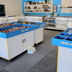 Bricks & Minifigs - The store entrance is right in front of the bulk tables. Grab a container to fill with any LEGO that will fit. Also build or pick a minifig!
