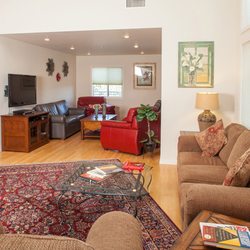 Arrowhead Lodge Recovery - Living room with fireplace in the lodge.