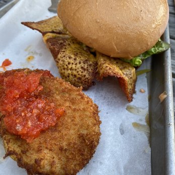 Magnolia & May - Burger with fried green tomatoes. So much fried cheese and that just made it explode with flavor!!!! - Bars Near Me - Memphis, Tennessee Magnolia & May - Burger with fried green tomatoes. So much fried cheese and that just made it explode with flavor!!!! - Bars Near Me - Memphis, Tennessee