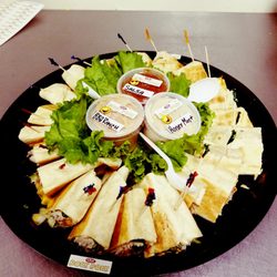 Roly Poly - This is our hot press platter feeds approximately 8 to 10 people. The Panini sandwiches are savory and crispy and yummy Yum yummy‼