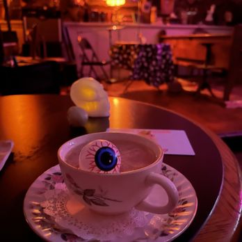 The Spirit Room - a cup of hot chocolate with an evil eye on it - Cocktail Bars Near Me - Rochester, New York The Spirit Room - a cup of hot chocolate with an evil eye on it - Cocktail Bars Near Me - Rochester, New York