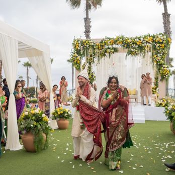 Ethnic Essence Inc. - Just-married couple walking away from the wedding venue (mandap) - Wedding Planning Near Me - Anaheim, California