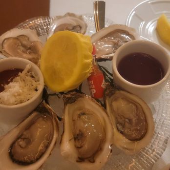 Rare Steakhouse - New England oysters with Champagne Shallot Vinegarette and Cocktail sauce - Steakhouses Near Me - Everett, Massachusetts