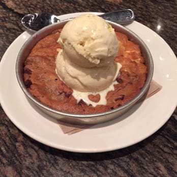 BJ's Restaurant & Brewhouse - 1/2 chocolate chip 1/2 white chocolate macadamia pizookie - New American Near Me - Downey, California