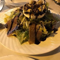Salad with Jamon, goat cheese, nuts and dried fruit. Salad with Jamon, goat cheese, nuts and dried fruit.