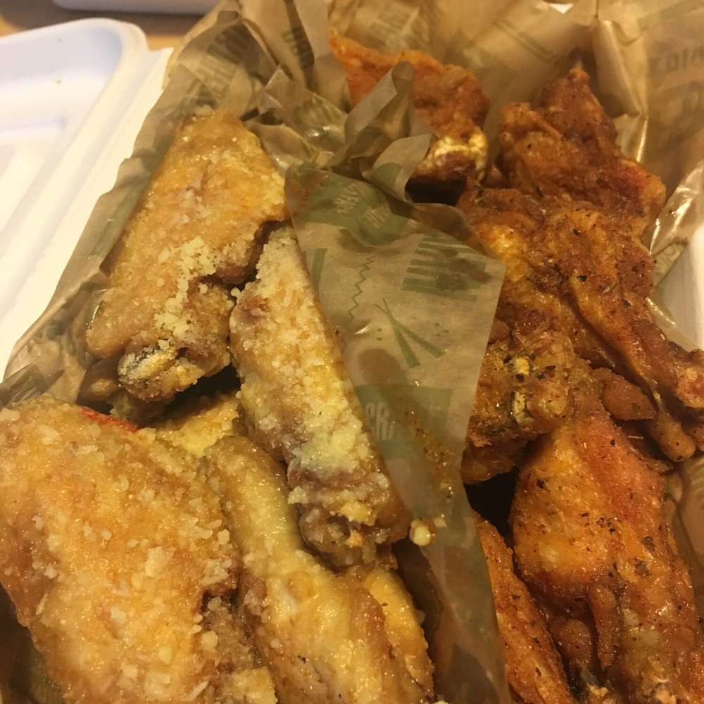 Wingstop - Garlic Parmesan (left) and Louisiana Rub (right) - Chicken Wings Near Me - Germantown, Maryland Wingstop - Garlic Parmesan (left) and Louisiana Rub (right) - Chicken Wings Near Me - Germantown, Maryland