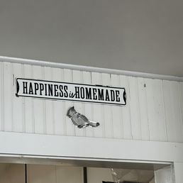 a sign on the wall above a doorway